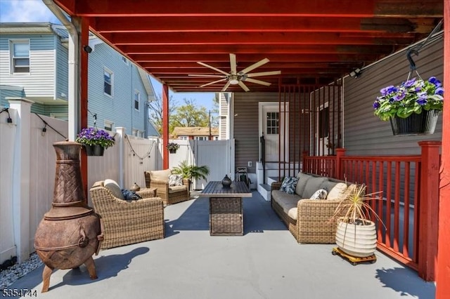 view of patio / terrace featuring a ceiling fan, an outdoor hangout area, and a fenced backyard