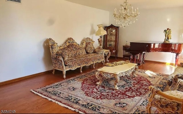 305 Old York Rd, Raritan Twp, NJ 08822 - living area featuring baseboards, a notable chandelier, and wood finished floors