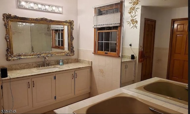 305 Old York Rd, Raritan Twp, NJ 08822 - bathroom featuring a garden tub, wainscoting, and vanity