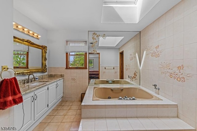 305 Old York Rd, Raritan Twp, NJ 08822 - full bath with a skylight, tile walls, a tub with jets, tile patterned floors, and vanity