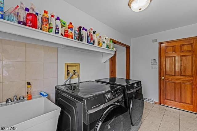 305 Old York Rd, Raritan Twp, NJ 08822 - laundry area featuring washing machine and clothes dryer, light tile patterned floors, laundry area, and a sink