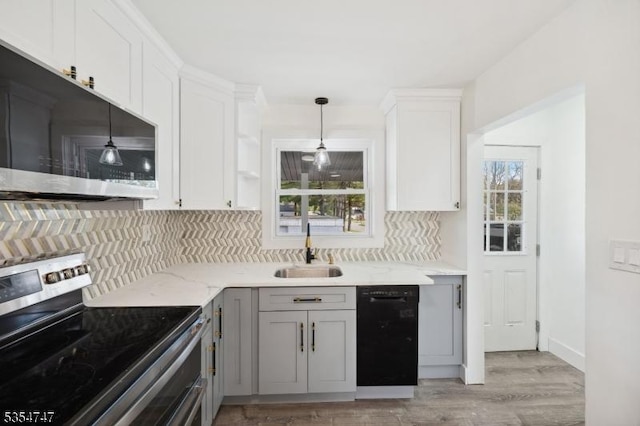202 Parkside Ave, Pohatcong Twp, NJ 08865 - kitchen featuring appliances with stainless steel finishes, a sink, backsplash, and gray cabinetry