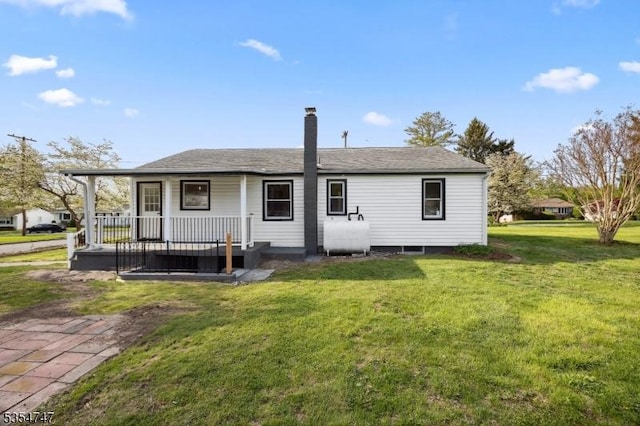202 Parkside Ave, Pohatcong Twp, NJ 08865 - back of property with oil tank, a yard, a chimney, and a shingled roof
