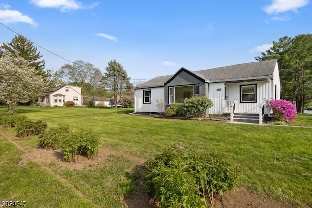 202 Parkside Ave, Pohatcong Twp, NJ 08865 - view of front of property featuring a front lawn, board and batten siding, and a shingled roof