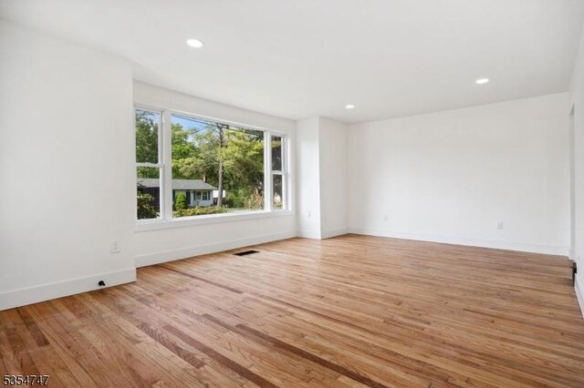 202 Parkside Ave, Pohatcong Twp, NJ 08865 - empty room with wood finished floors, recessed lighting, and baseboards