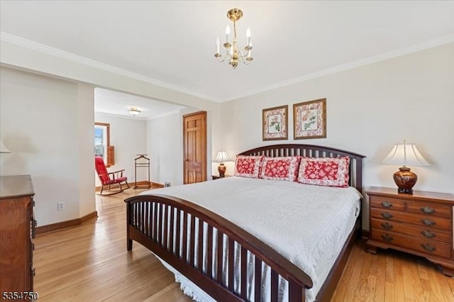 bedroom with light wood-style floors, baseboards, an inviting chandelier, and crown molding