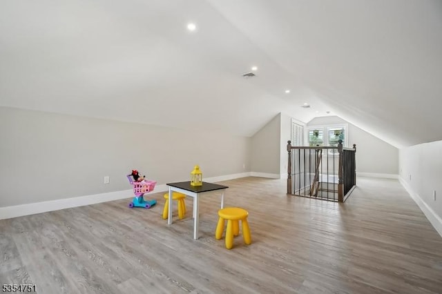 223 Victor St, Scotch Plains Twp, NJ 07076 - recreation room featuring baseboards, vaulted ceiling, wood finished floors, and visible vents