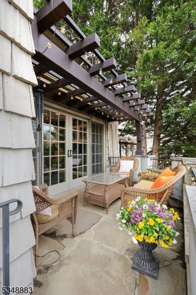 view of patio featuring french doors and a pergola
