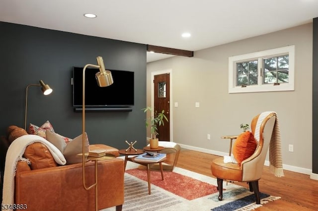 living room featuring recessed lighting, baseboards, and wood finished floors