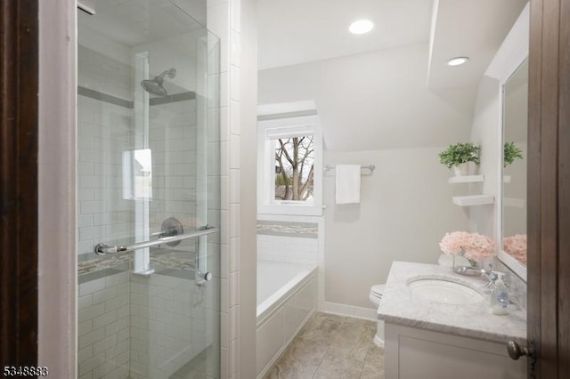 full bathroom featuring vanity, toilet, baseboards, a bath, and a stall shower