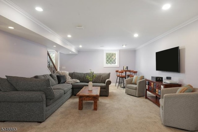 living room featuring plenty of natural light, ornamental molding, recessed lighting, and light colored carpet