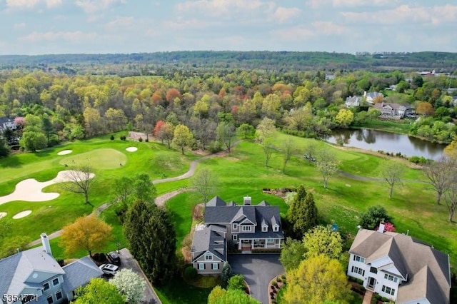 aerial view featuring a water view, golf course view, and a residential view