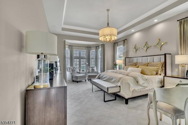 bedroom with recessed lighting, a chandelier, and a tray ceiling