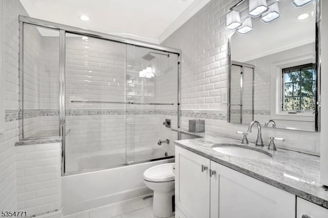 bathroom featuring crown molding, vanity, toilet, recessed lighting, and enclosed tub / shower combo