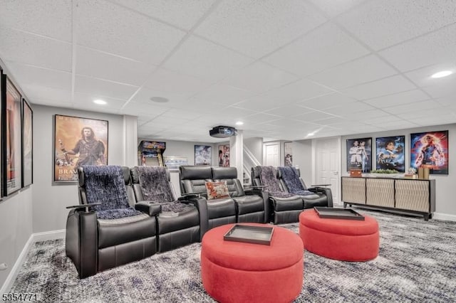 home theater room with baseboards, carpet flooring, and a drop ceiling