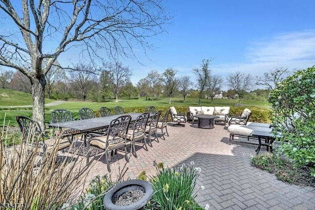 view of patio / terrace with an outdoor living space and outdoor dining space
