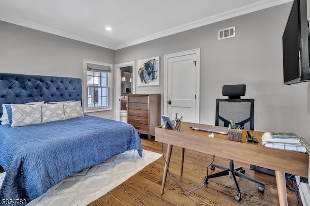 bedroom featuring ornamental molding, recessed lighting, wood finished floors, and visible vents