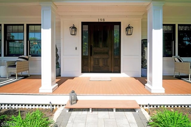 property entrance with covered porch