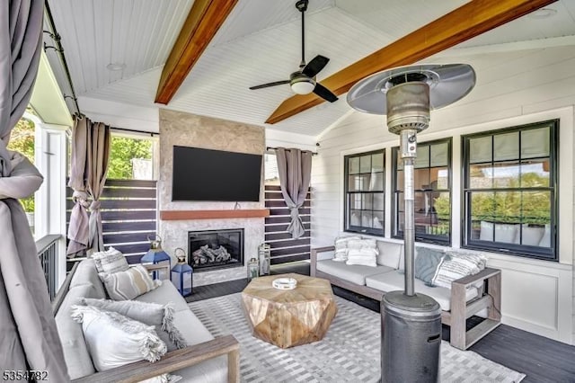 exterior space featuring an outdoor hangout area and ceiling fan