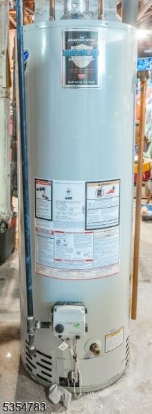 utility room featuring gas water heater