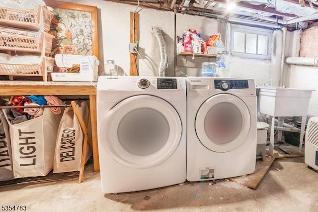 laundry room with laundry area and washer and clothes dryer