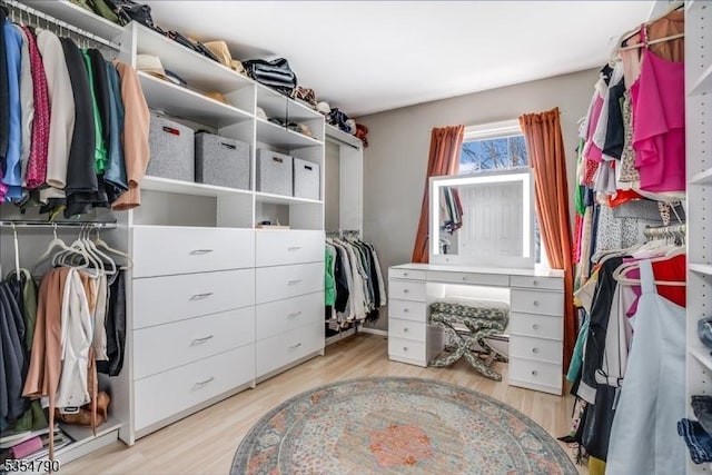 spacious closet with light wood finished floors