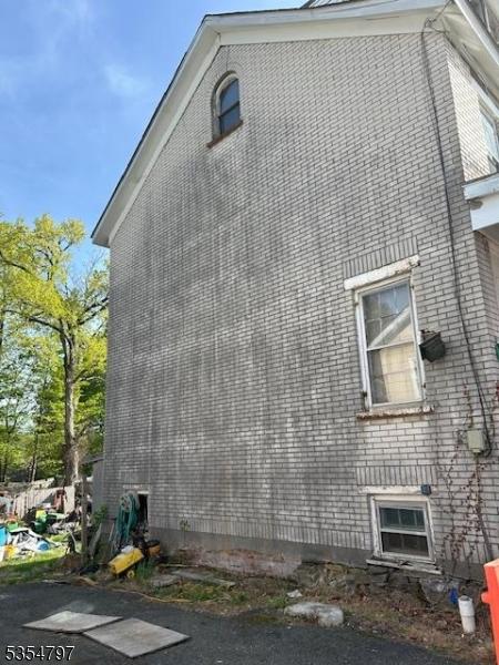 view of home's exterior featuring brick siding