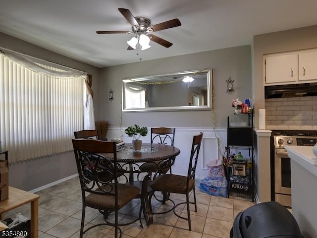 dining space featuring ceiling fan and light tile patterned floors