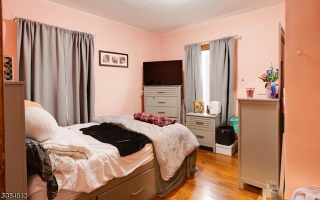 bedroom featuring wood finished floors