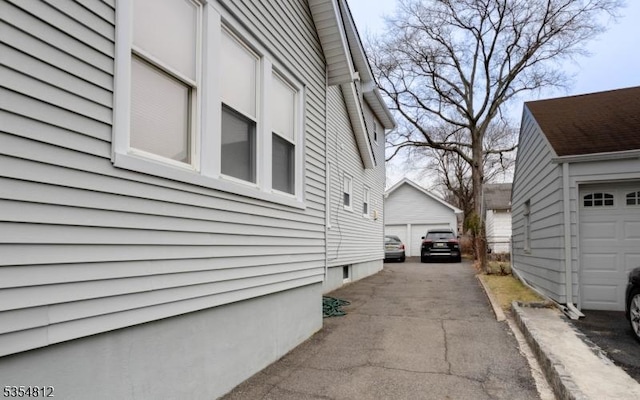 view of side of property featuring an outdoor structure