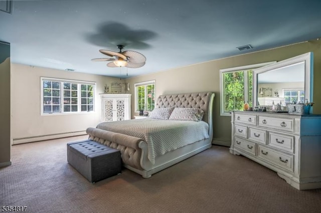 carpeted bedroom featuring visible vents, a ceiling fan, and a baseboard heating unit