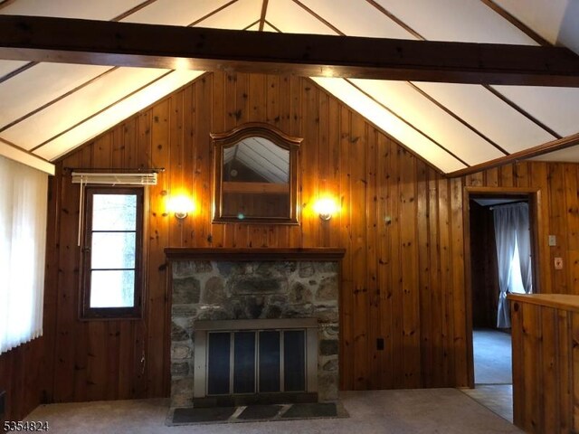 218 Wawayanda Rd, Vernon Twp, NJ 07422 - unfurnished living room with wooden walls, carpet floors, vaulted ceiling with beams, and a fireplace