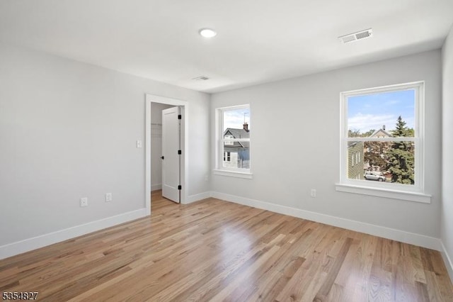 spare room with recessed lighting, baseboards, visible vents, and light wood-style flooring