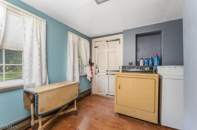 laundry area featuring laundry area, independent washer and dryer, and wood finished floors