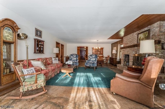 living room featuring an inviting chandelier and a fireplace