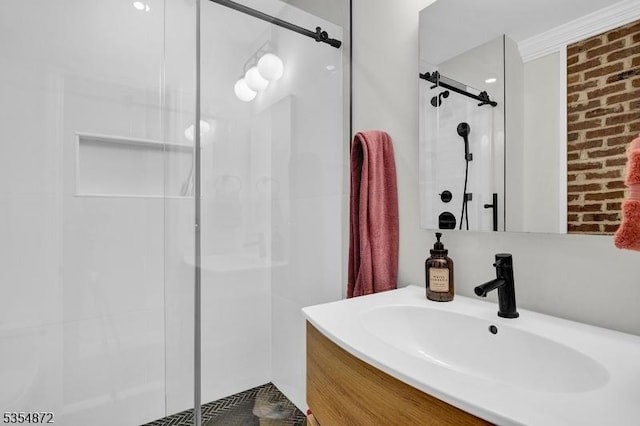 bathroom with a shower stall, brick wall, and vanity
