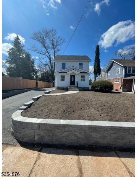 view of front of home with fence