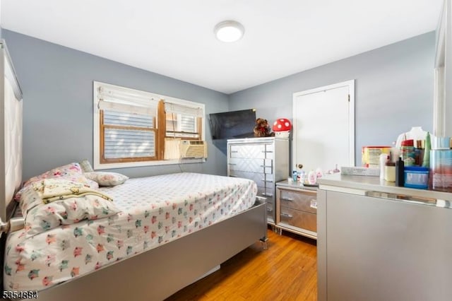 bedroom featuring light wood-style flooring