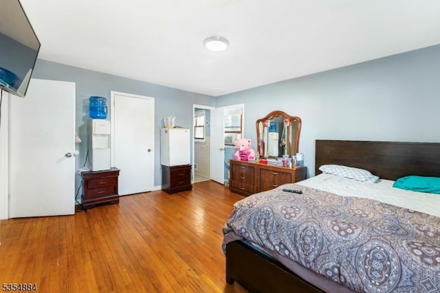 bedroom with wood finished floors