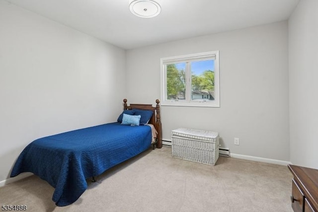 carpeted bedroom featuring baseboards and baseboard heating