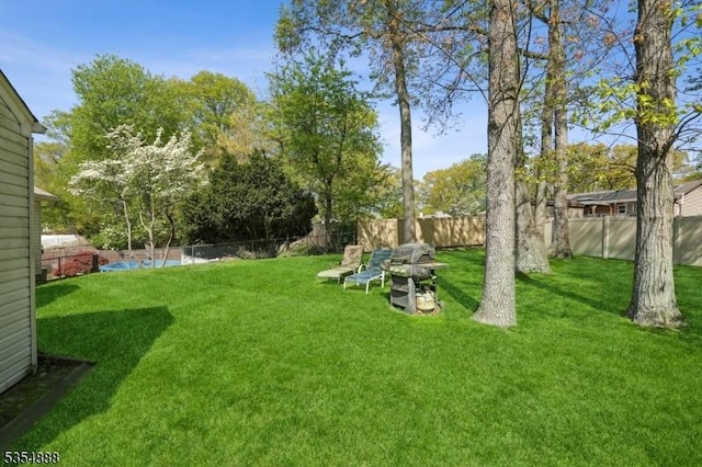 view of yard with a fenced backyard