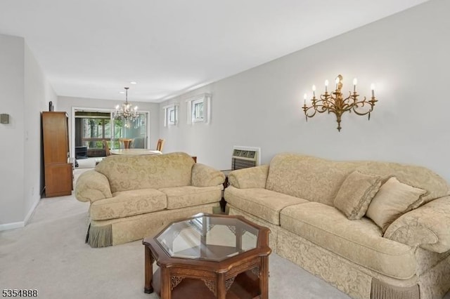 living room with baseboards, a chandelier, and light carpet
