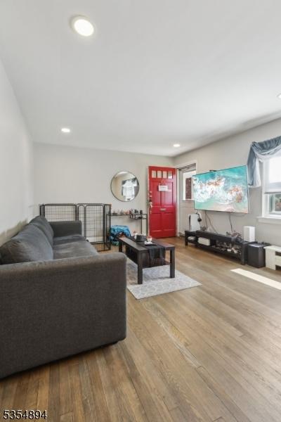 living area featuring recessed lighting and wood finished floors