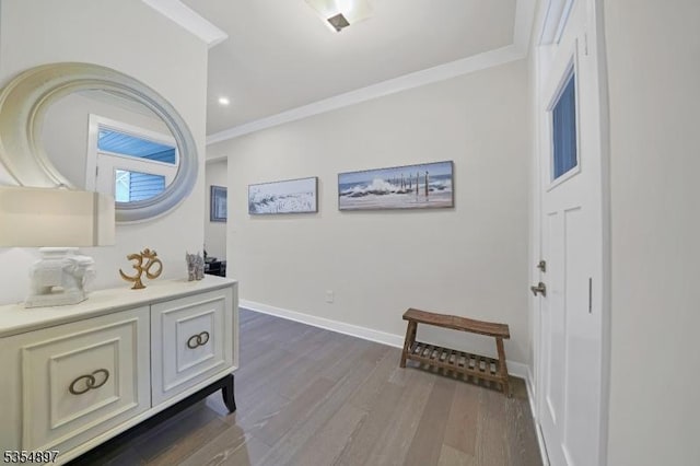 interior space featuring recessed lighting, baseboards, ornamental molding, and wood finished floors