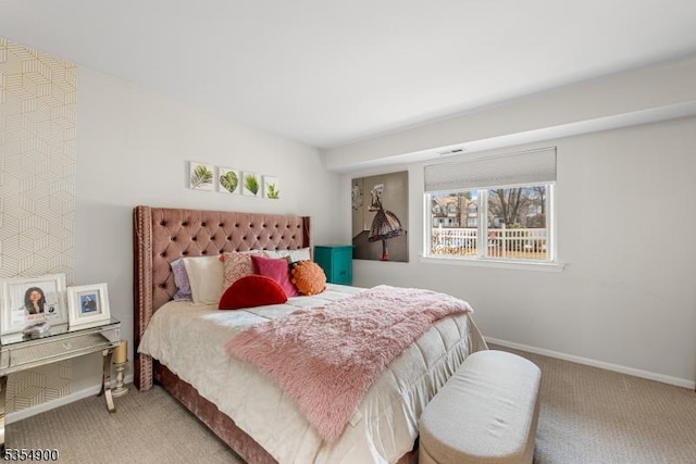 carpeted bedroom featuring baseboards