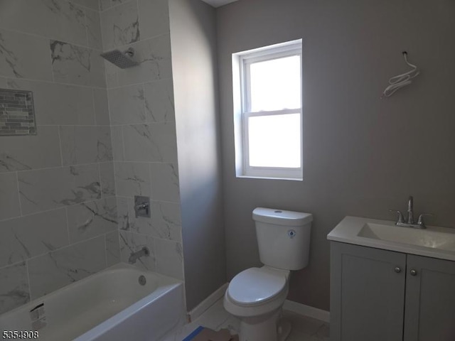 bathroom featuring toilet, baseboards, plenty of natural light, and vanity