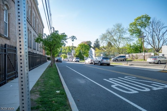 view of road featuring sidewalks and curbs