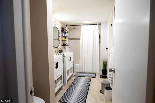 bathroom with toilet, shower / bath combo, and vanity