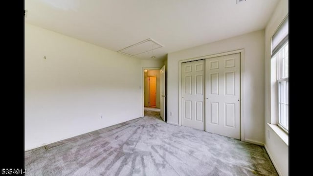27 Suydam Rd, Franklin Twp, NJ 08873 - unfurnished bedroom featuring attic access, multiple windows, and carpet floors