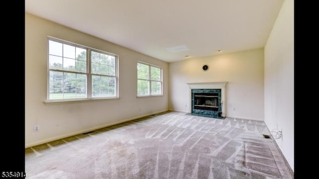 27 Suydam Rd, Franklin Twp, NJ 08873 - unfurnished living room featuring carpet floors, a high end fireplace, and baseboards